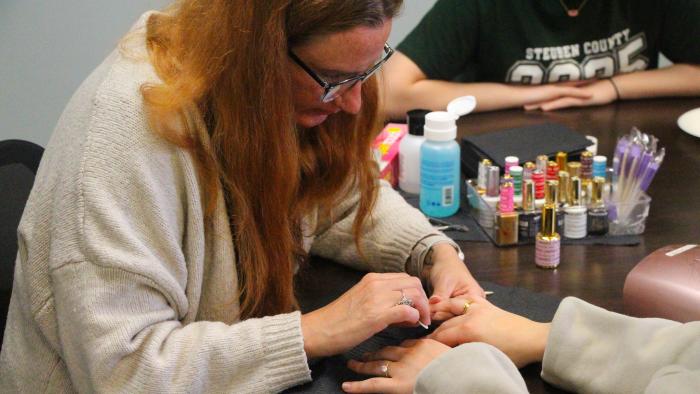 Student gets a manicure at Destress Fest