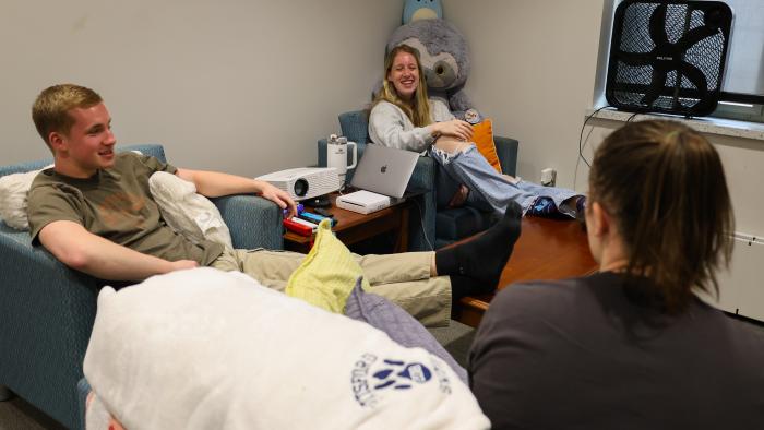 Students relax in their MacKenzie Commons living room