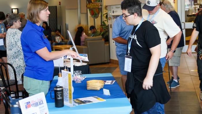 Student visits Career Services table at Orientation
