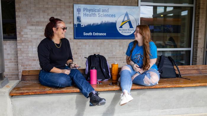 Female students enjoy some down time between classes