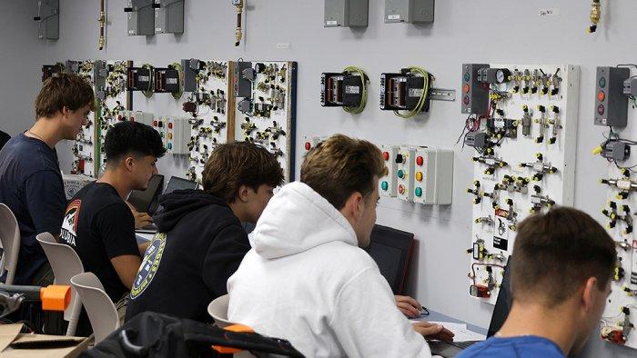Senior Electrical students work in their brand new electrical lab.