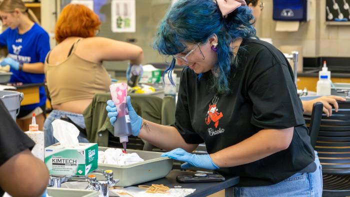 Science students decorate their lab coat