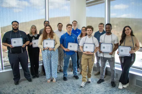 The inaugural class of students and professionals that were inducted into Alpha Alpha Alpha.