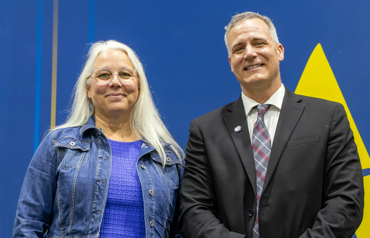 Jen Enke was one of two recipients of the Civic Engagement award, pictured here with President Dr. Mauro.