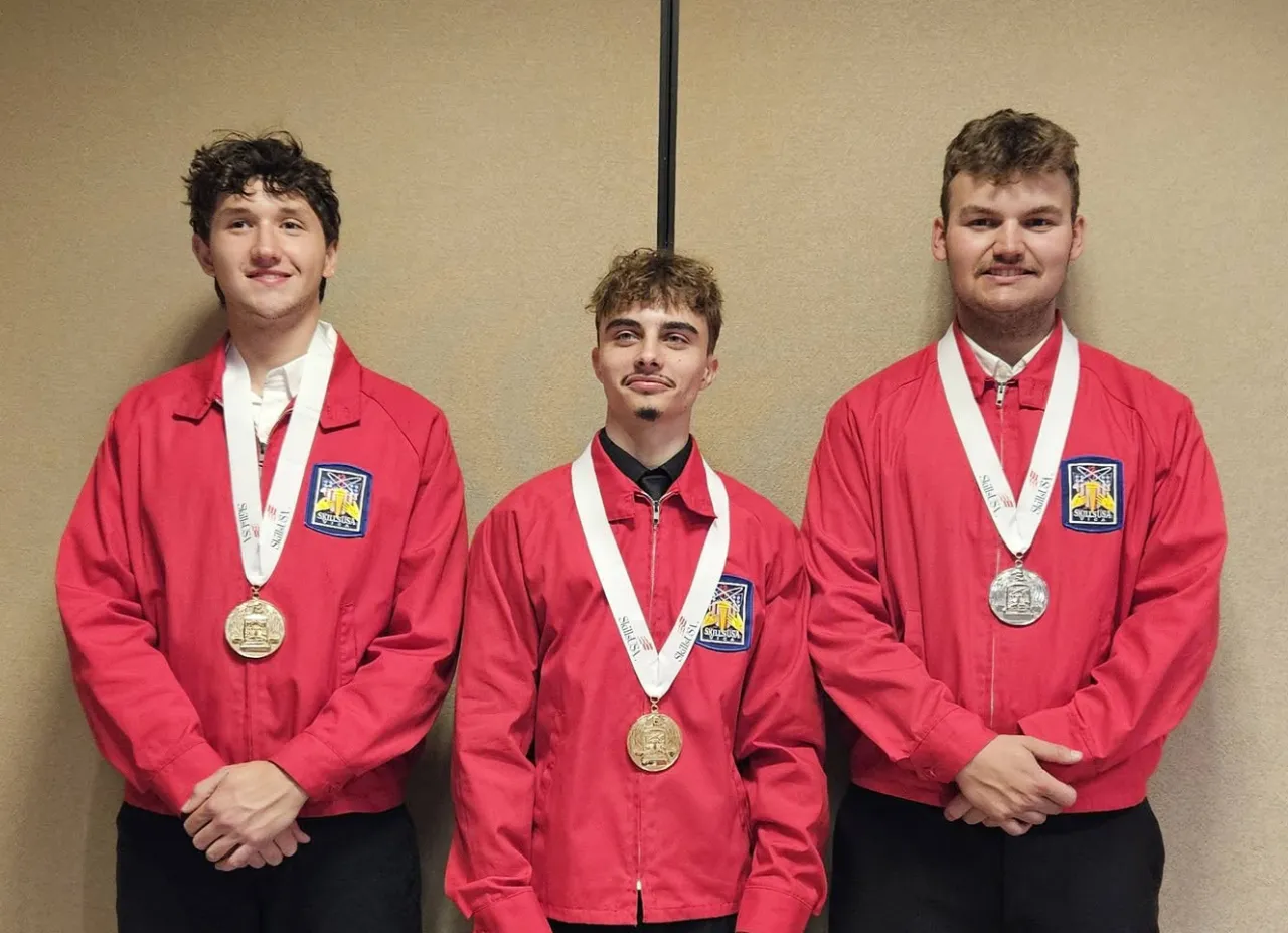 Three Alfred State students display their medals after competing in the SkillsUSA Competition