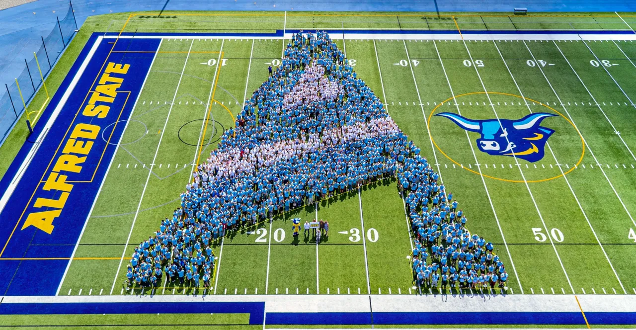 Students making the A logo for 2026.