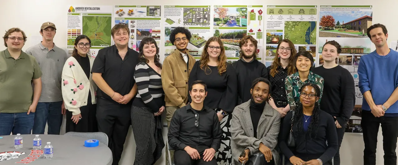 Professor Vlakancic's studio stands in front of their designs.