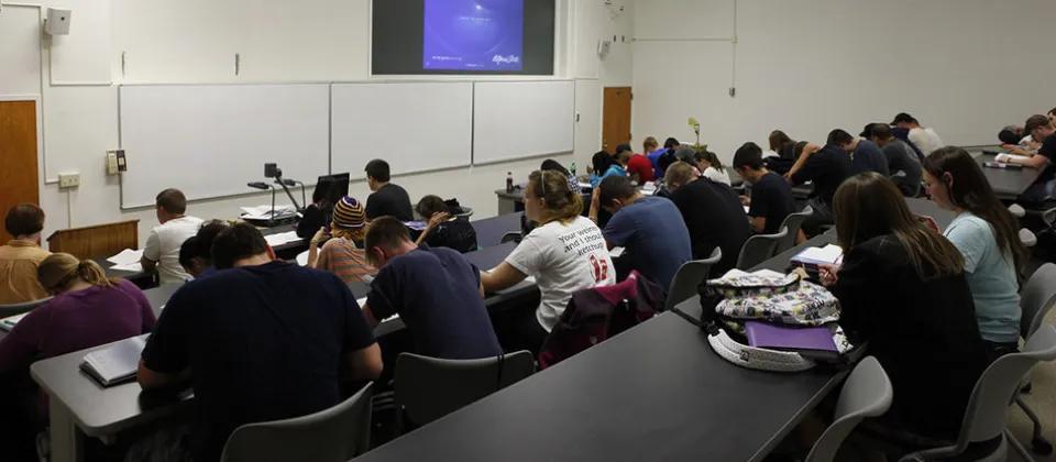 Students sitting inside classroom.