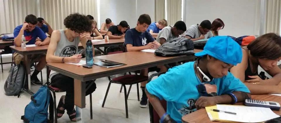 Students working on assignment in a classroom.