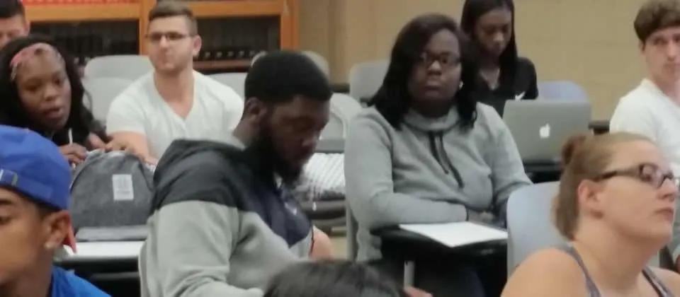 Students sitting at desks in a classroom.