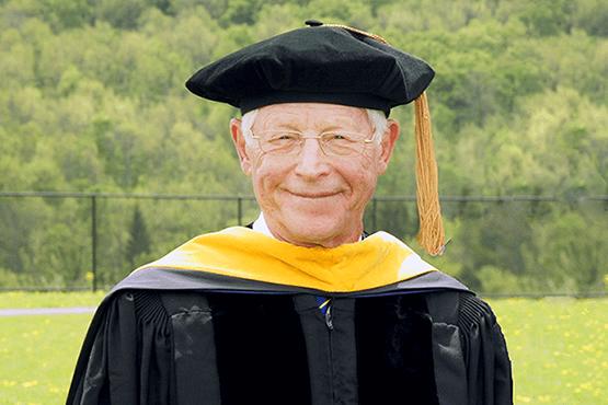 Dr. James Ferry with cap and gown on