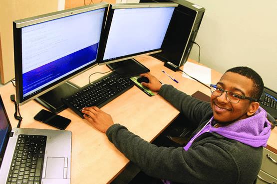 Juwan Gross in front of a computer