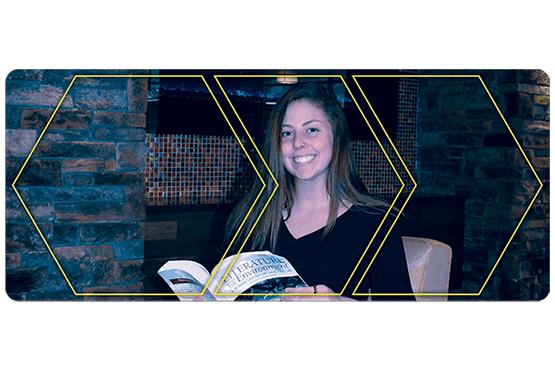 Mackenzie Congdon holding a book open