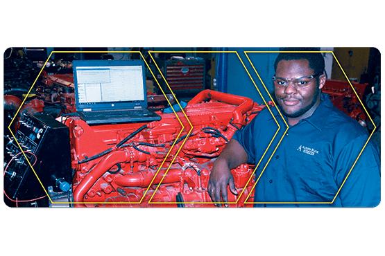 Nizair Evans in a lab with auto equipment
