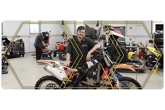 Seth Cooney by dirt bike in lab.