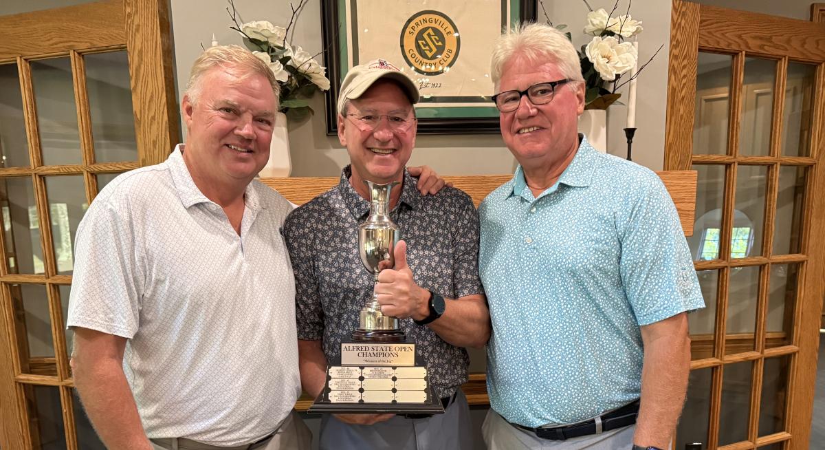 2025 Alfred Open champs with their trophy, missing Dave Bellso