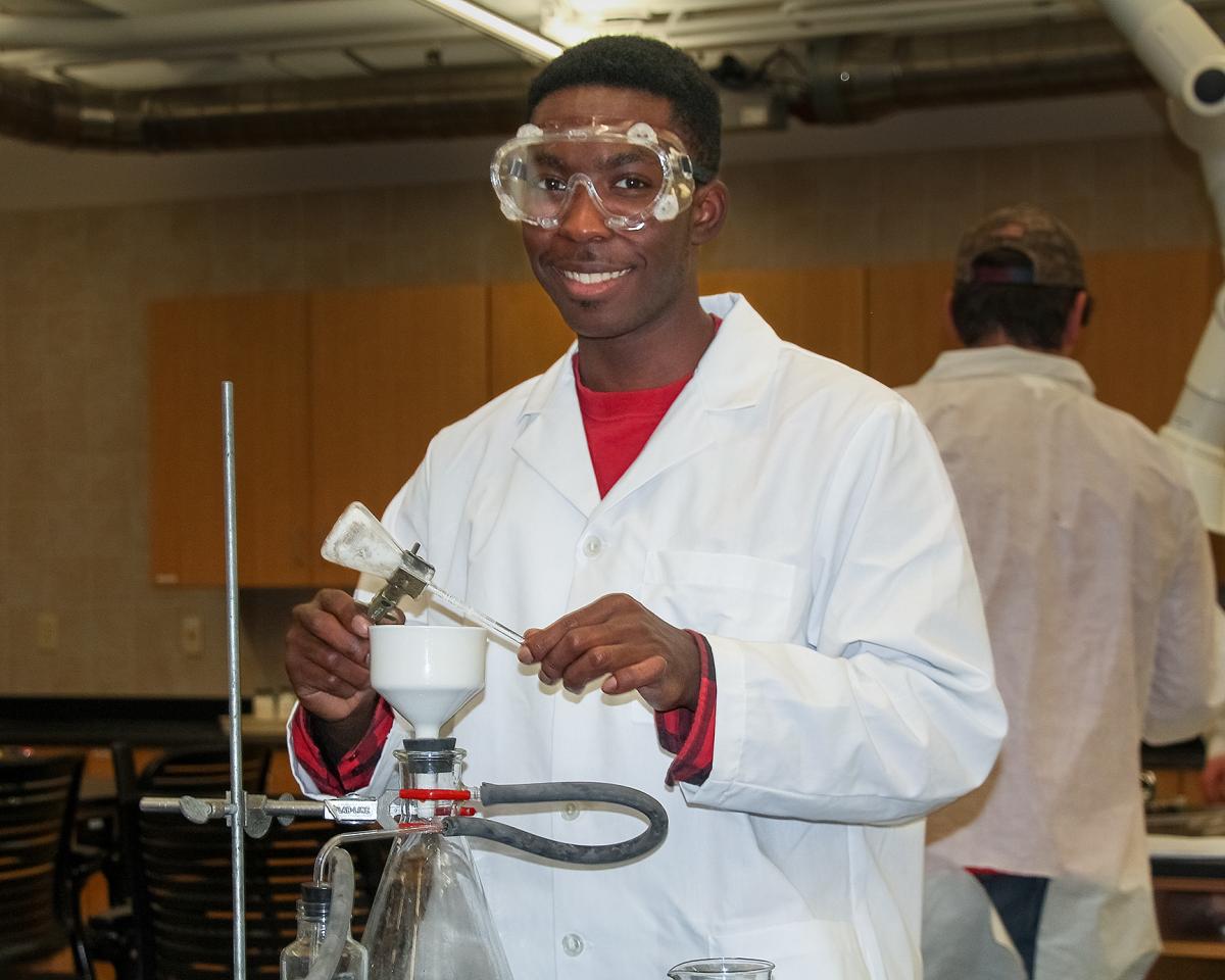 ASC student performing experiments in the chemistry lab.