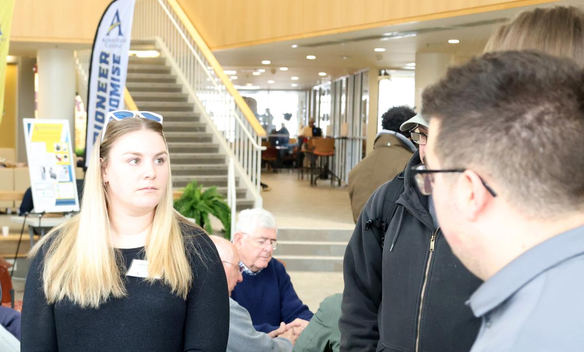 Allison DeGraff listens to students during a presentation