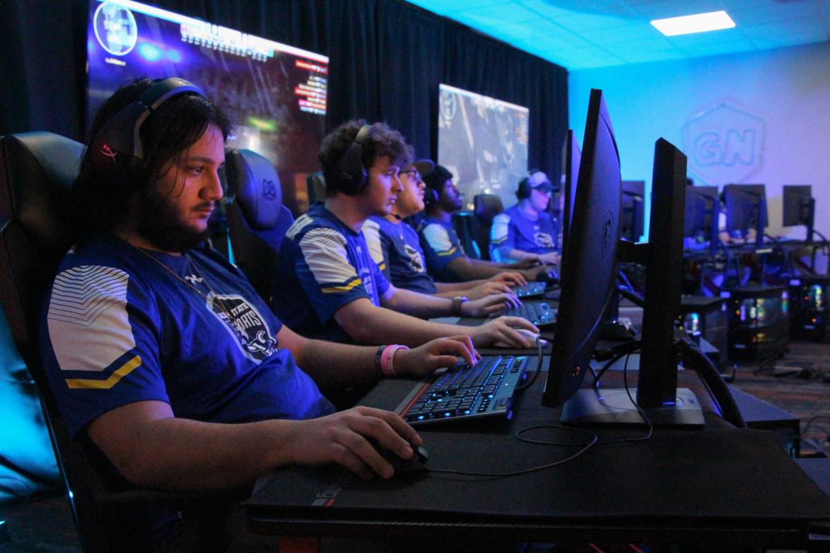   Students playing videogames in an esports arena

