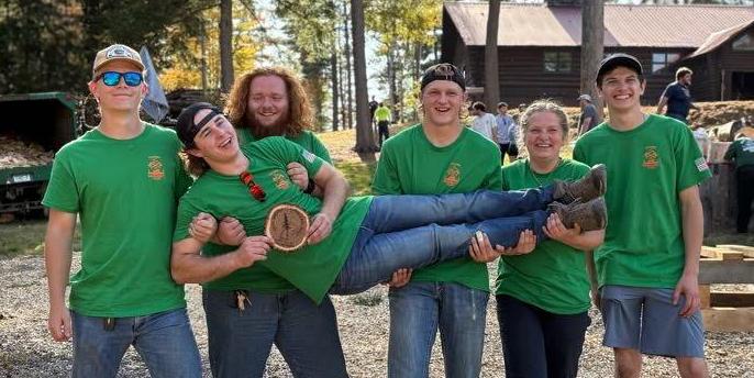 Logging sports team celebrates victory