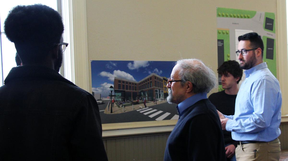 Students speak with resident about architecture design