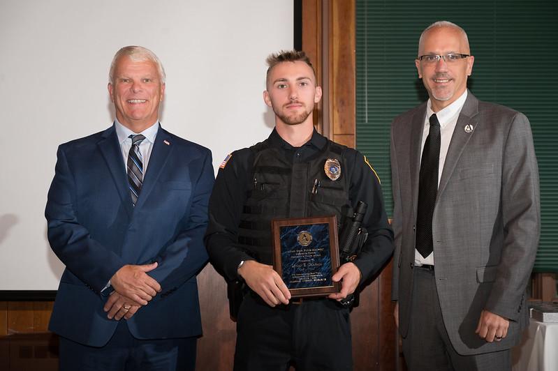 Graduating cadet with his award