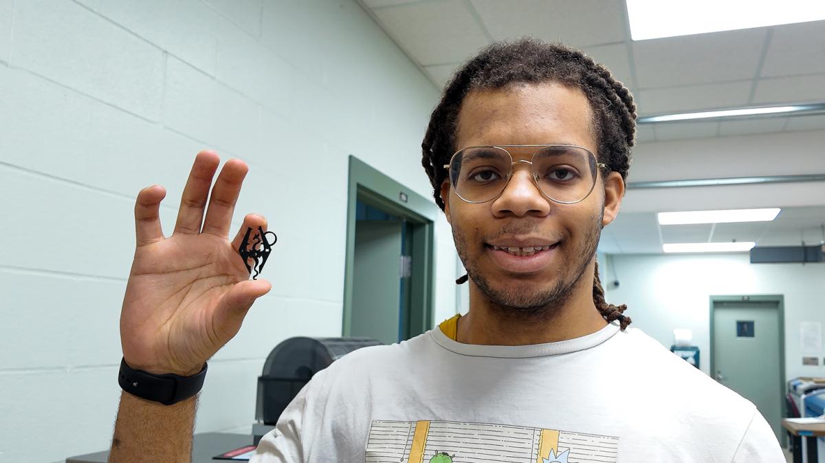 Student shows off a 3D print