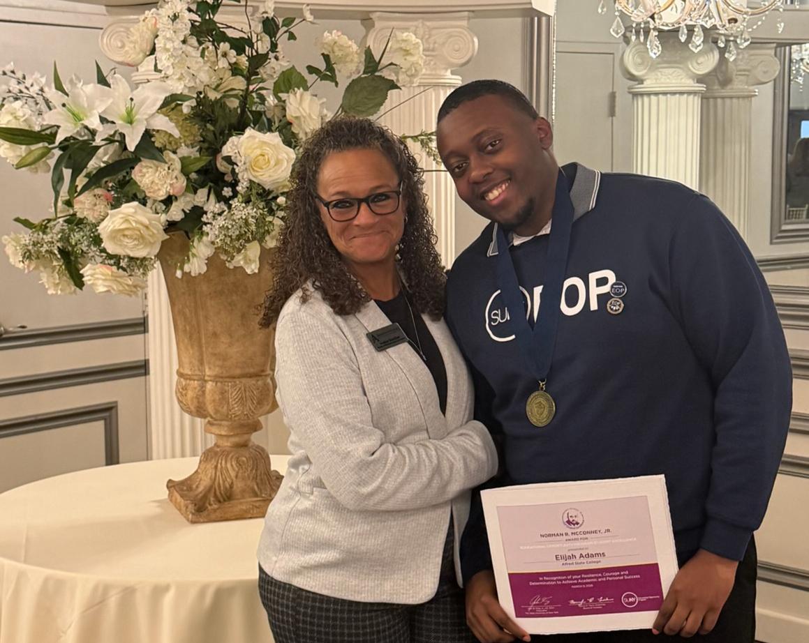 Elijah Adams stands with EOP Director Nadine Shardlow