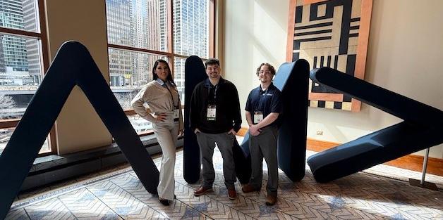 students pose with their professor