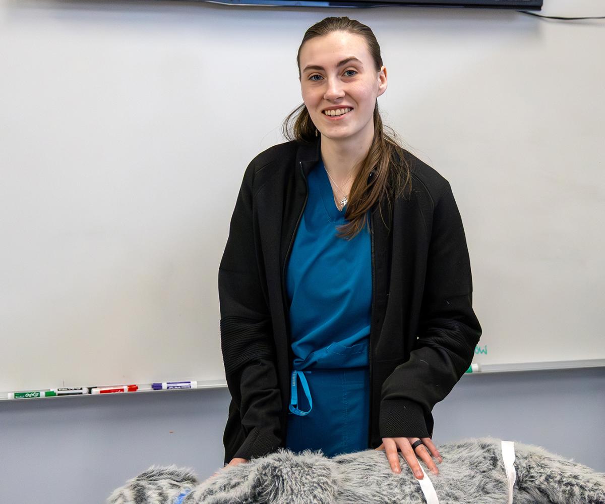 student in a vet tech lab.