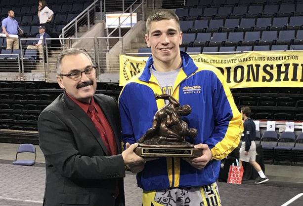 Ian Van Valen receives his Most Outstanding Wrestler award