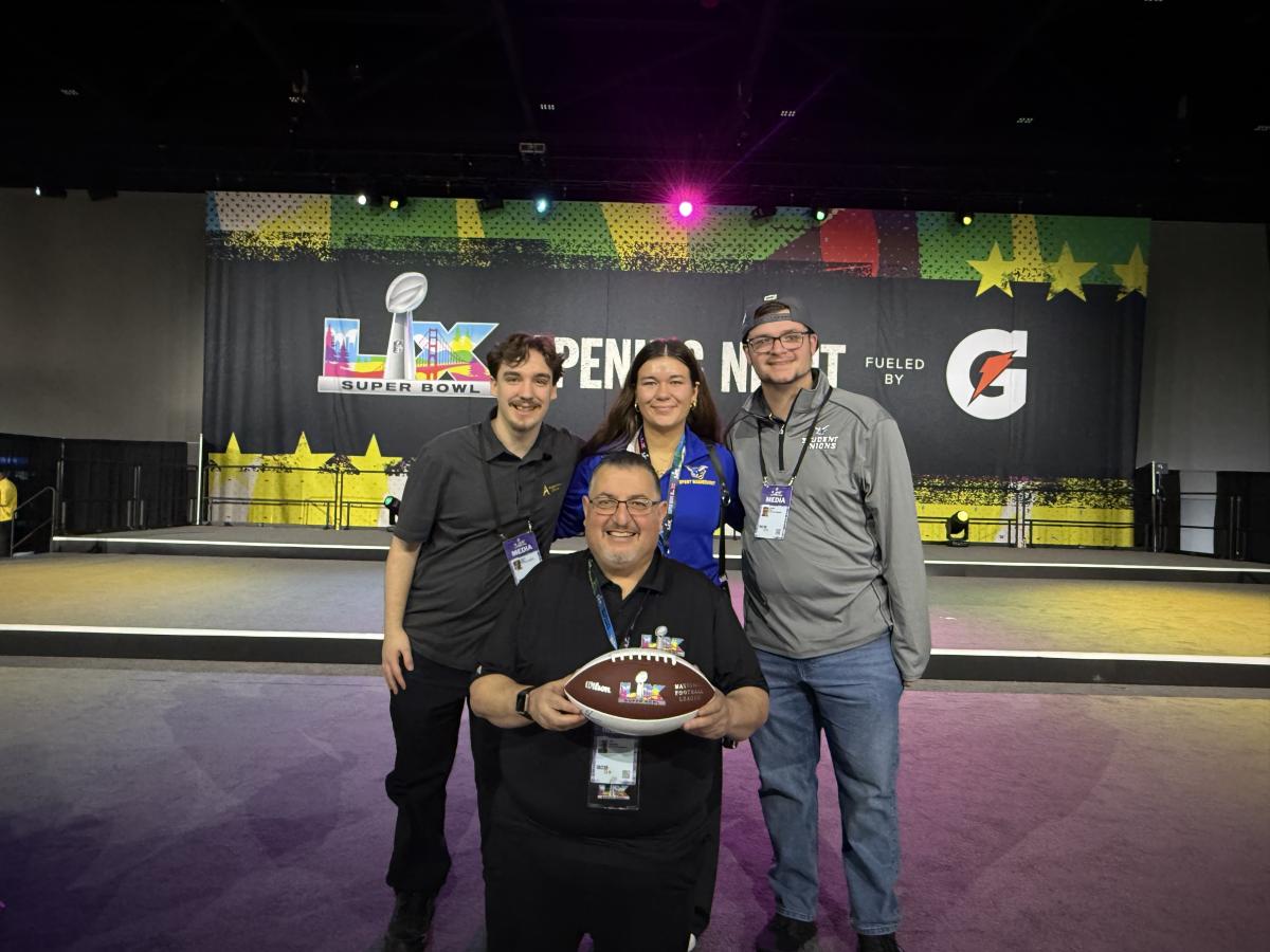 Alfred State students and their advisor at the Super Bowl