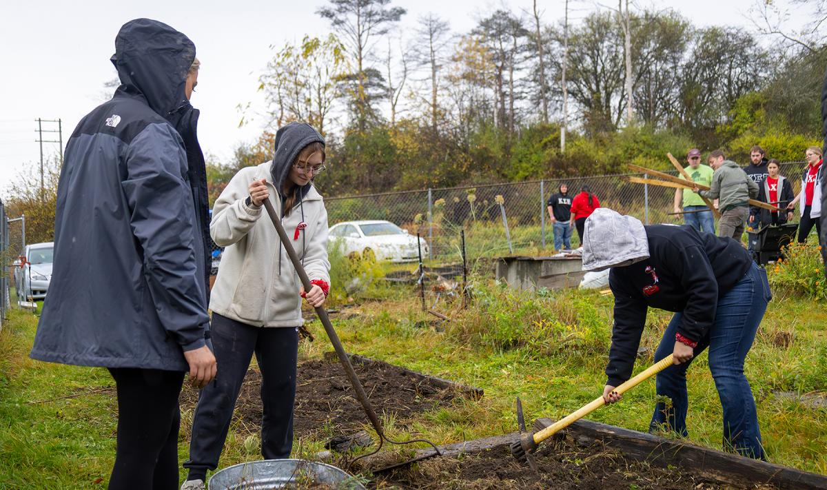 students work in the community garden