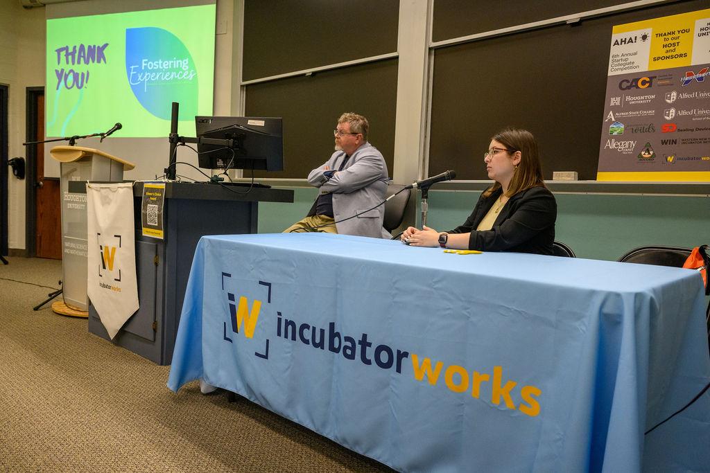 Students answers questions at a pitch competition
