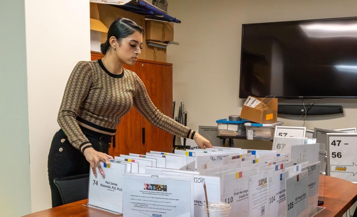 student works preparing for a recent career fair