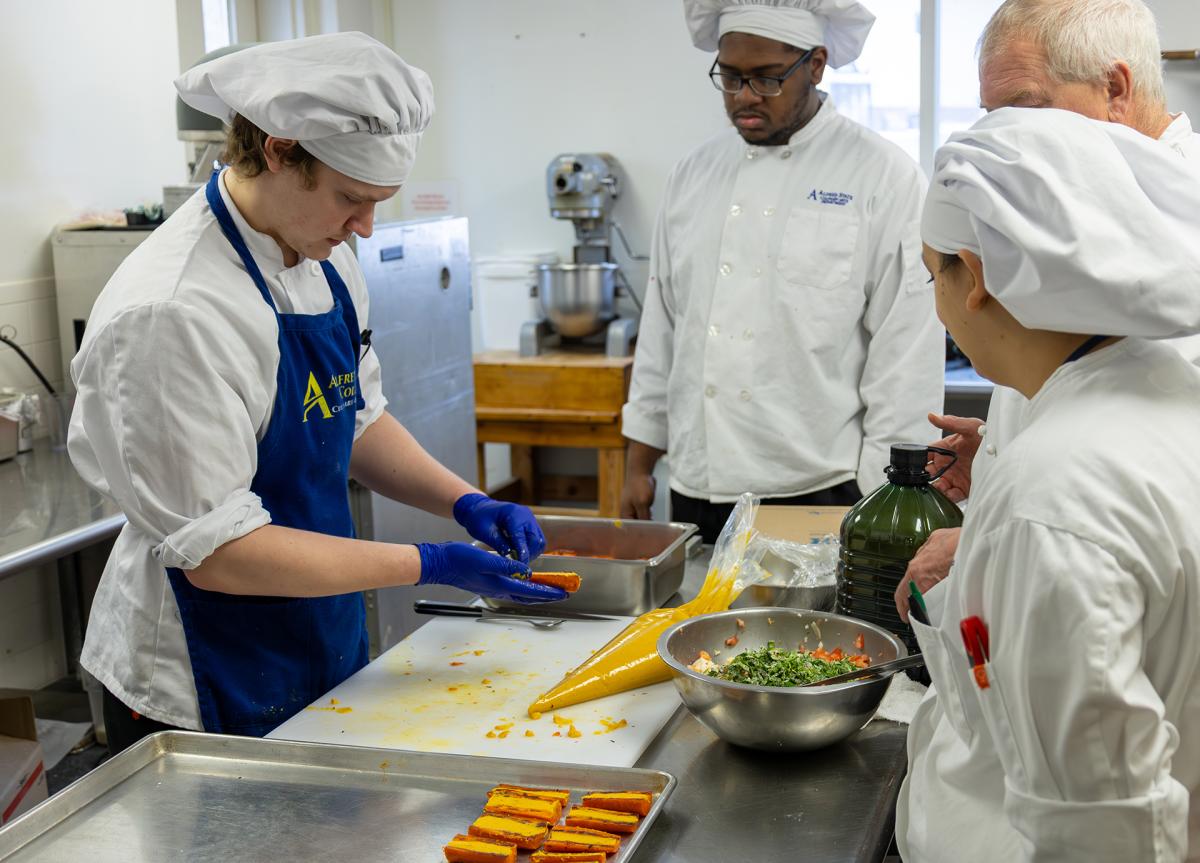 Students work in the kitchen