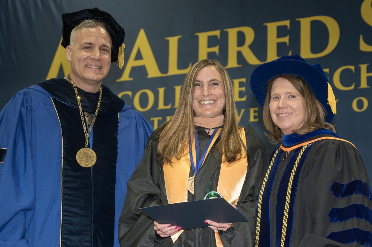 Danielle Green was honored with an award, presented by Dr. Mauro and Danielle Green