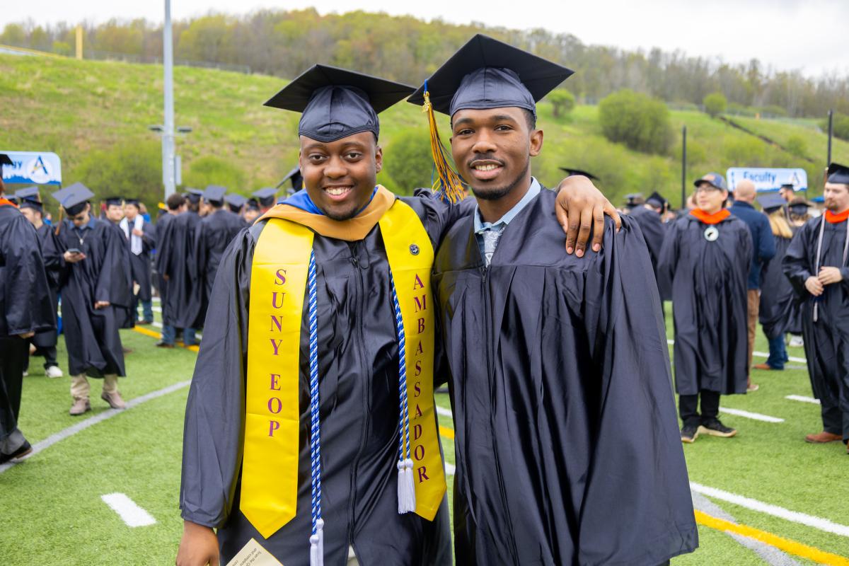 Elijah Adams and a friend at commencement