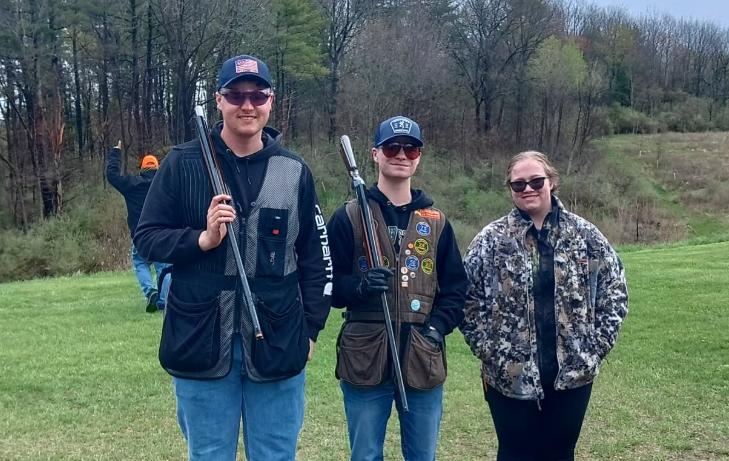 student pose after shooting a round for the Trap Team