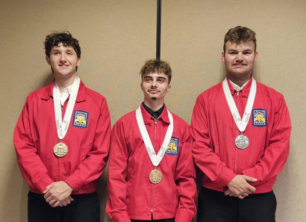 Three Alfred State students display their medals after competing in the SkillsUSA Competition