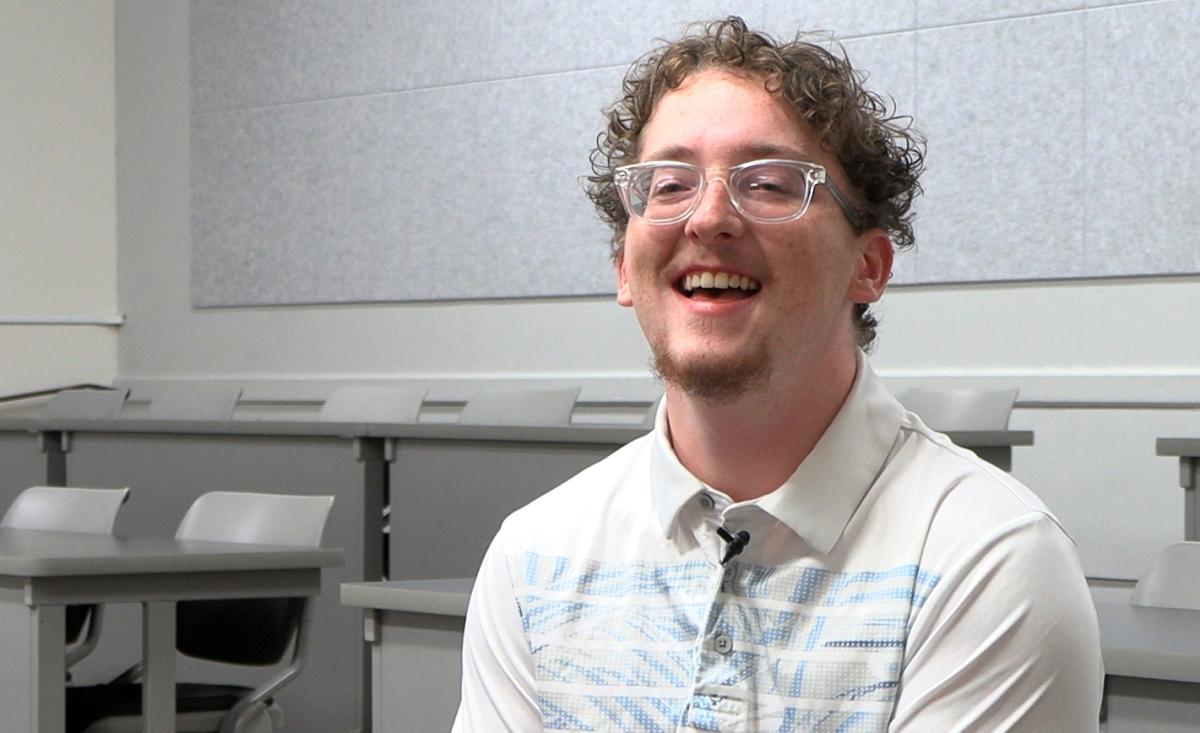 student laughing in a classroom