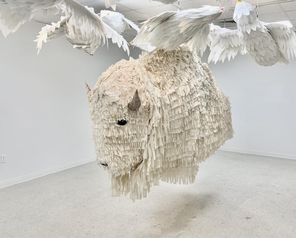 life-size buffalo and seagull puppet