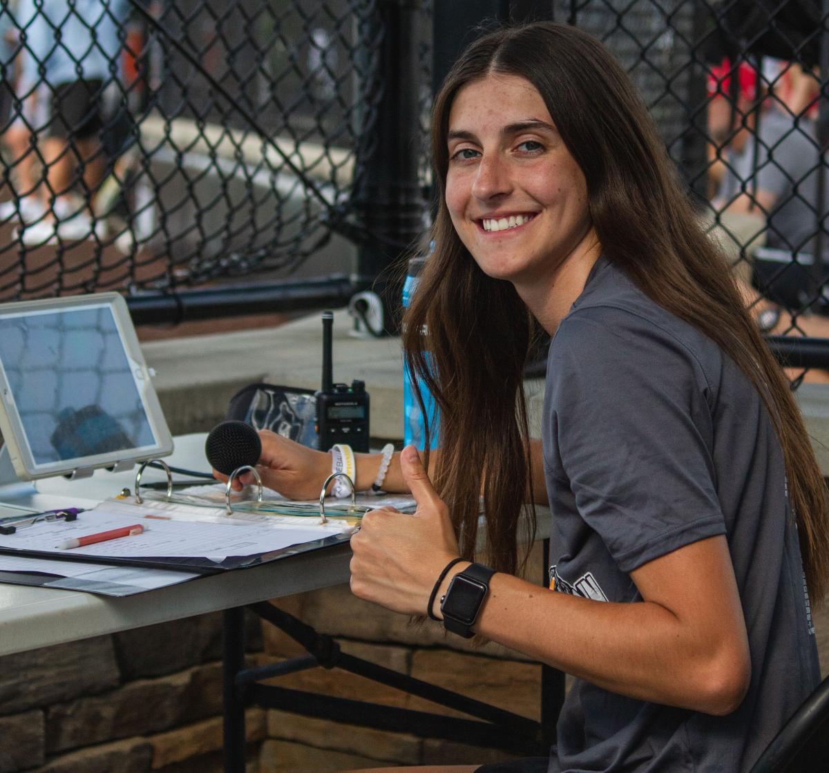 Jenna George works at the Ripken Experience during her internship