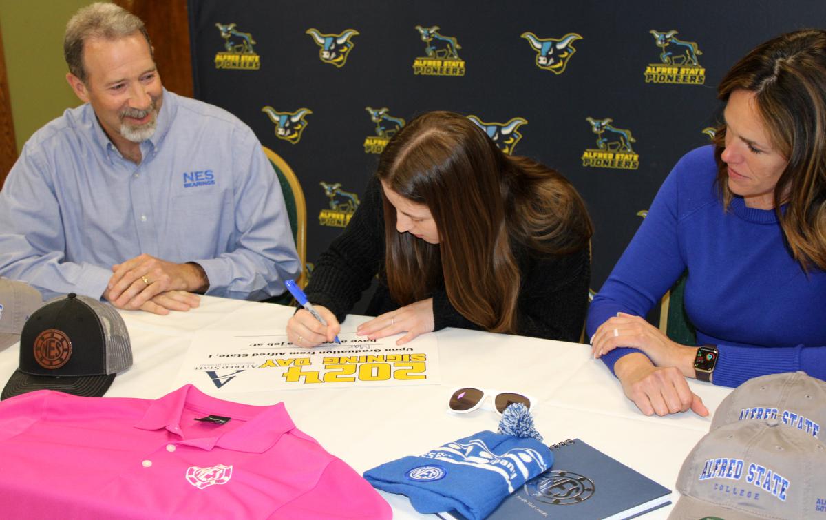 student signs to work at Napoleon Engineering Services
