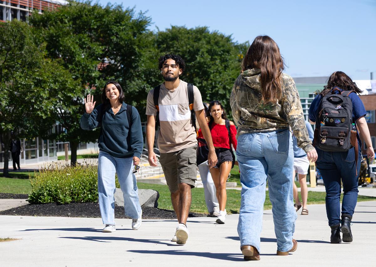 students walking on the spine of campus