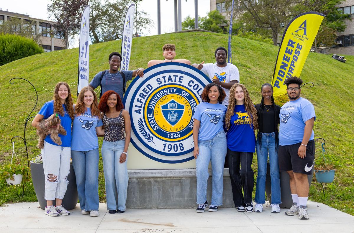 smiling students at the college seal