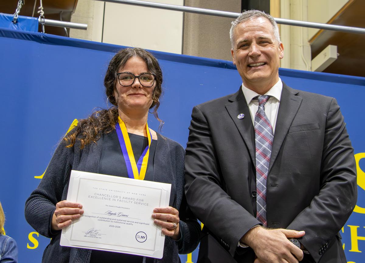 Dr. Graves with President Mauro after receiving an award