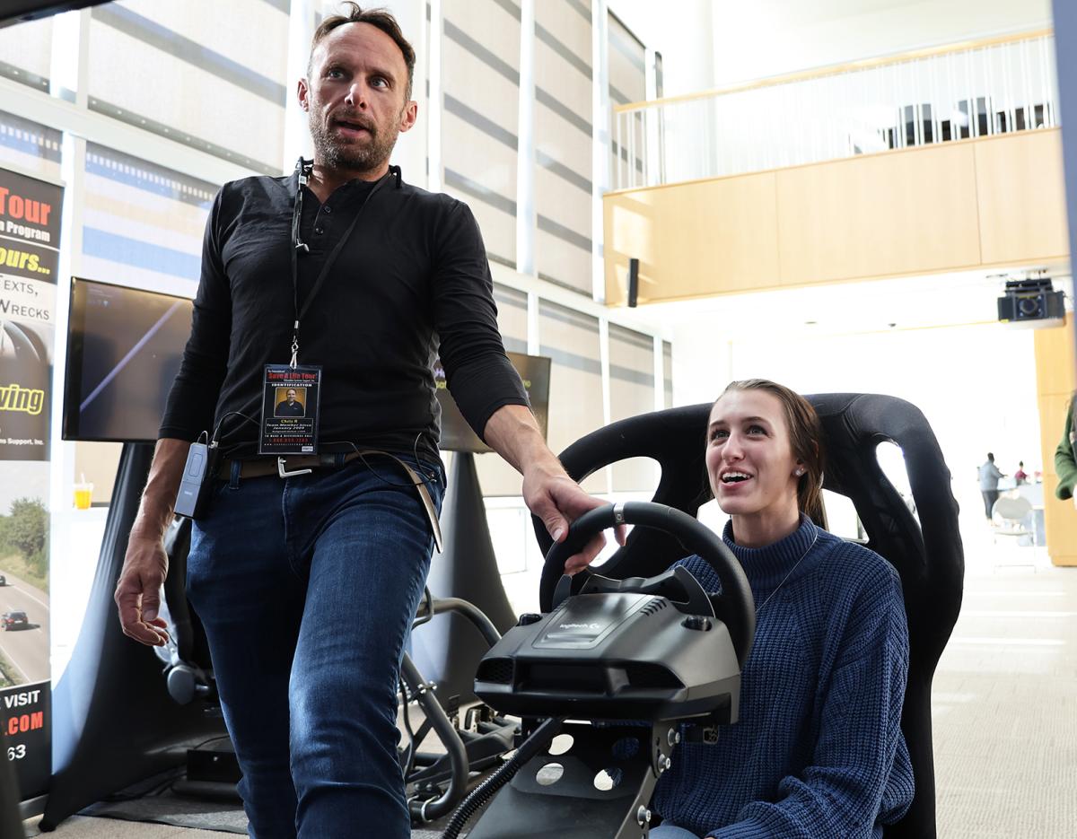 student participates in a simulation car at the Safe a Life Tour stop.