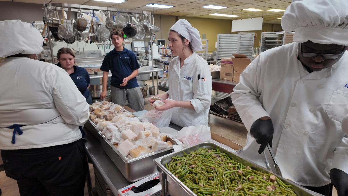 Students work to prepare a meal