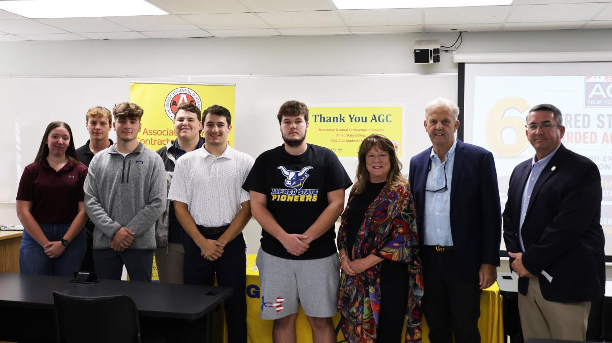 Scholarship winners pose with members of AGC of NYS